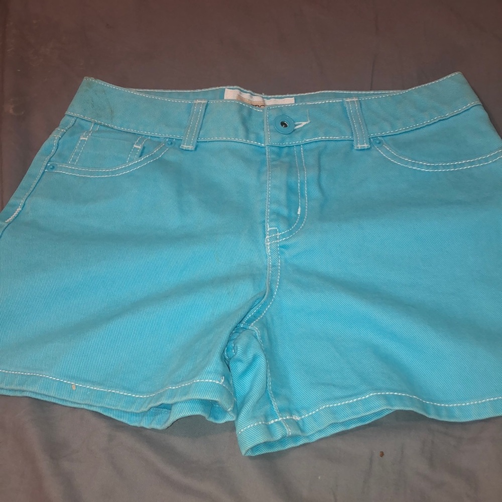 never worn blue shorts